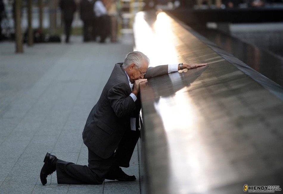 Robert Peraza, who lost his son Robert David Peraza in 9/11, pauses at his son’s name at the North  ...
